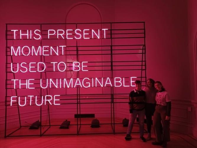 Grace, Hannah and Sarah Pratt pose next to an art installation that appeared in the Smithsonian's Renwick Gallery where the butter cow sculpture they would carve for the State Fairs exhibit would eventually be on display a year later.