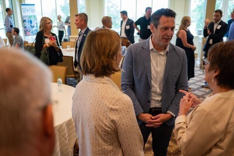 Republican candidate for Iowa governor Zach Lahn speaks with guests at an Iowa Association of Business and Industry event at Glen Oaks Country Club on Aug. 24, 2026, in West Des Moines.