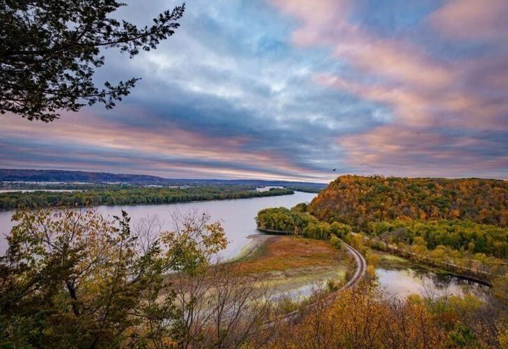 The sun rises over the Mississippi River at Effigy Mounds National Monument in Harpers Ferry Iowa, Oct. 22, 2025.