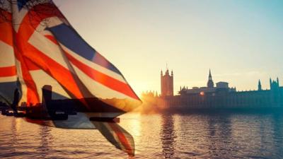 British union jack flag and Big Ben Clock Tower and Parliament house at city of Westminster in the background