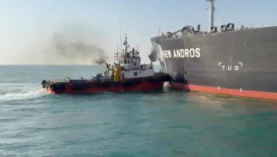 Water is sprayed on oil tanker New Andros, at Sea