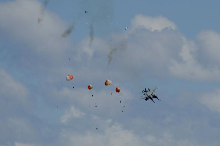 Military jets' crew members eject safely following a mid-air collision during the Idaho air show outside Mountain Home Air Force Base in Idaho