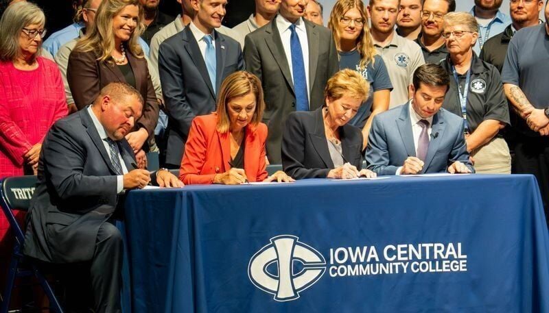 Jesse Ulrich, Kim Reynolds, Linda McMahon and Keith Sonderling sign the approval for the new Workforce Pell grant program at Iowa Central Community College's Fort Dodge campus on Aug. 4.