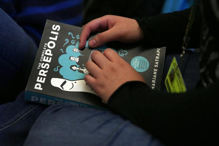 Lane Tech High School book club discusses "Persepolis" during club meeting after class in Chicago on March 20, 2013.