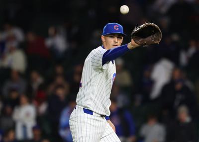 Chicago Cubs pitcher Hoby Milner retrieves the ball to throw against the Philadelphia Phillies in the ninth inning April 22, 2026, at Wrigley Field in Chicago.