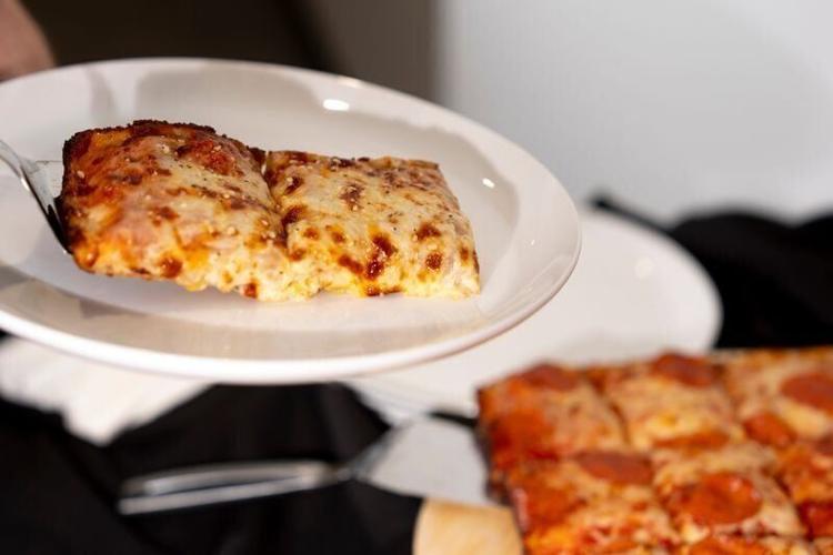 Slices of Casey’s cheese pan pizzas are served Oct. 22, 2026 in Ankeny, Iowa.