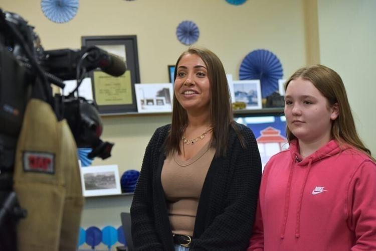 Alexis Newton, left, and Mya Cannon speak with reporters following an April 7, 2026, City of Urbandale awards ceremony recognizing their lifesaving actions.