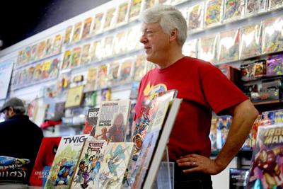 Flying Color Comics owner Joe Field with a display of graphic novels at his shop on Nov. 16, 2022, in Concord, California.