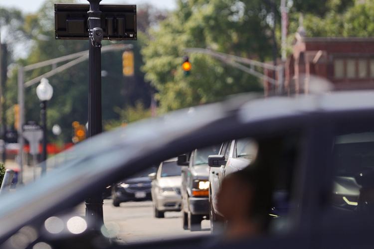 A Flock camera trains its lens on vehicles traveling down County Street in New Bedford, Massachusetts, on Aug. 20, 2026.