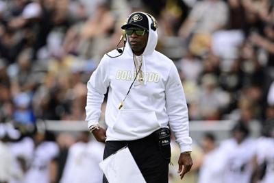 Colorado Buffaloes’ head football coach Deion "Coach Prime" Sanders walks the field during the Black and Gold spring football game at Folsom Field in Boulder, Colo., on Saturday, April 11, 2026.