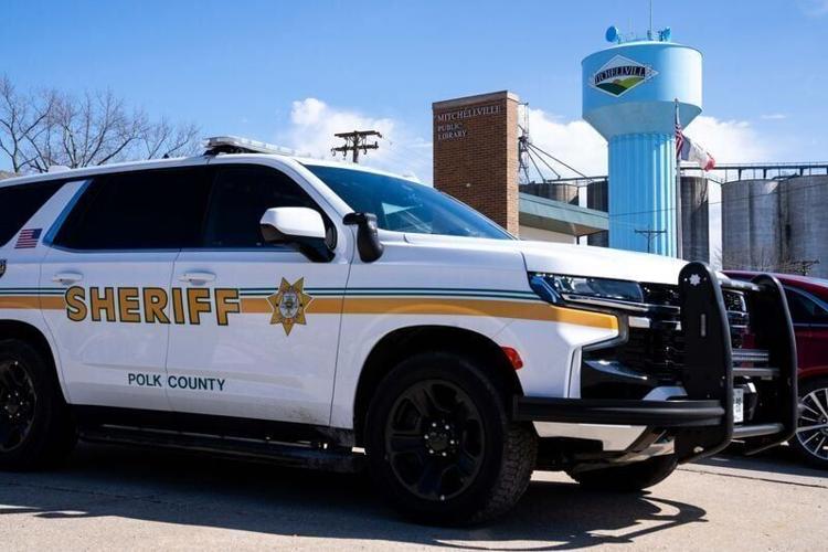 A Polk County Sheriff’s vehicle patrols downtown Mitchellville during an afternoon shift in rural Polk County on April 10, 2026.