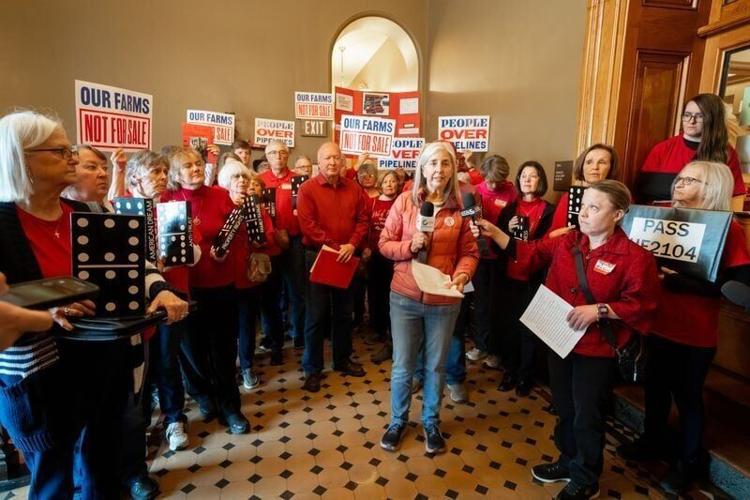 Julie Goebel speaks about eminent domain during a rally asking lawmakers to pass HF 2104, at the Iowa Capitol, April 7, 2026.