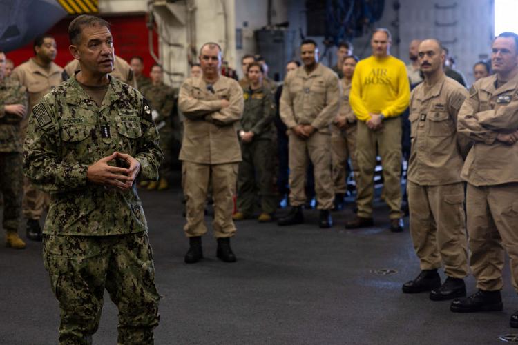 U.S. Navy Admiral Brad Cooper, commander of U.S. Central Command (CENTCOM), speaks to crew members of USS Tripoli