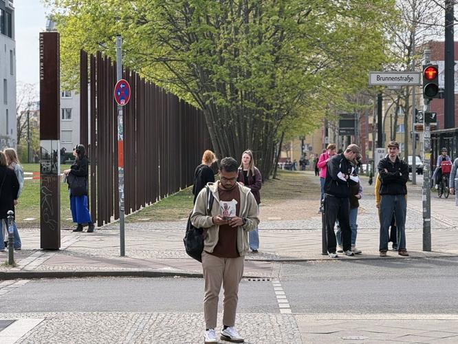 Tall metal poles along the former border between East and West are part of the Berlin Wall Memorial.