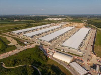 An aerial view of Microsoft's Project Ginger East data center campus in West Des Moines, built by local contractor The Weitz Co. In the distance lies Project Alluvion, another Microsoft campus. Photographed on August 3, 2026.