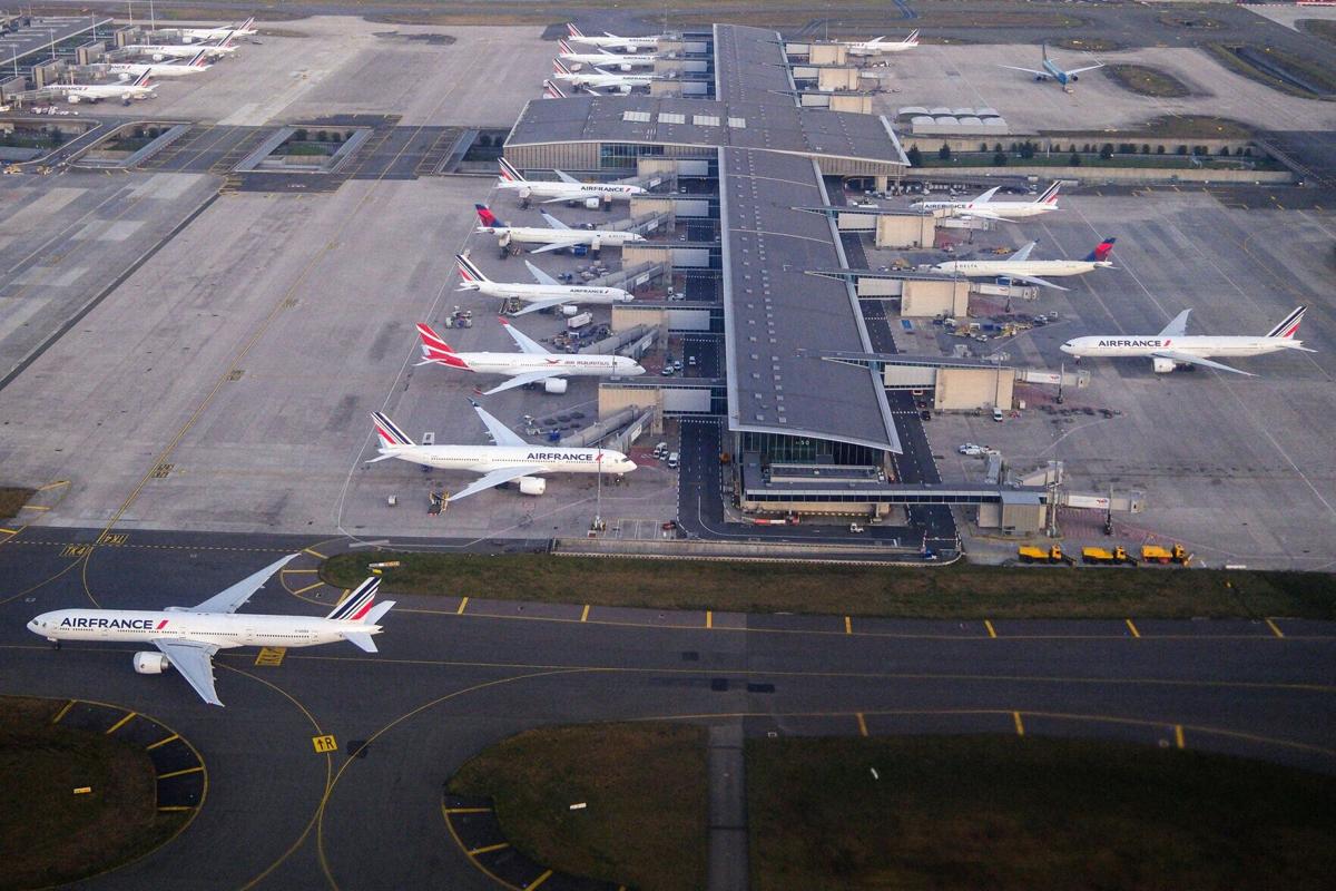 This photograph shows various passengers aircrafts at terminal at Roissy Charles de Gaulle airport in Roissy-en- France on Dec. 24, 2025.