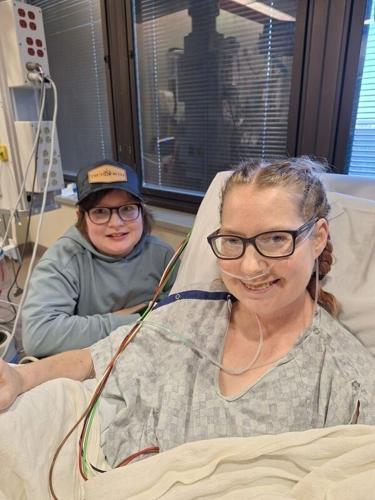 Elizabeth Wehrle and her son Landen sit together in the hospital after her quadruple organ transplant surgery.