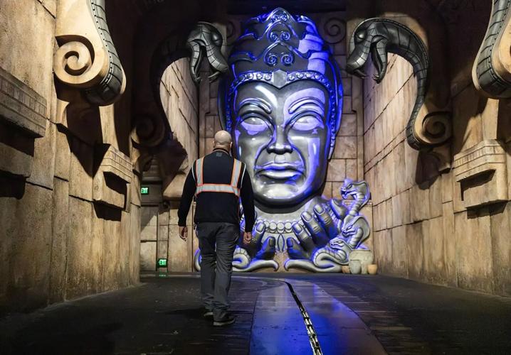 Nicholas DiBernardo, who helped lead the recent refurbishment of Indiana Jones Adventure, walks toward Mara, the deity within the Temple of the Forbidden Eye.