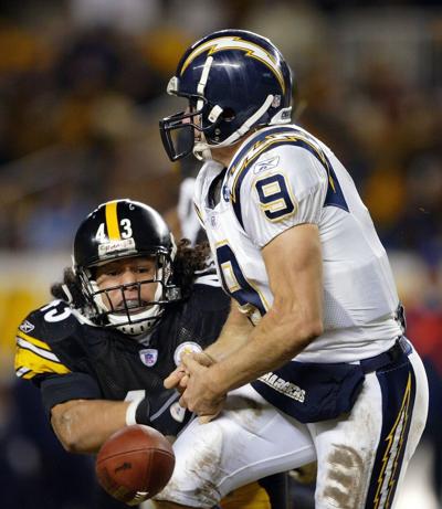 Pittsburgh Steelers safety Troy Polamalu forces a fumble as he knocks the ball from the hands of San Diego Chargers quarterback Drew Brees on Dec. 21, 2003, at Heinz Field in Pittsburgh.