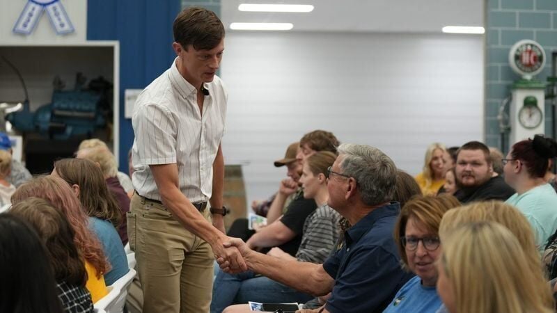 Iowa Democratic gubernatorial candidate Rob Sand shakes hands with attendees before his town hall on Tuesday, July 21, 2026, at Yesterday's Memories in Sanborn, Iowa.