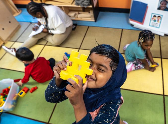 Ayesha Ahmed plays with a toy while attending a class at Wayne Metropolitan Community Action Agency Mitchell Head Start Center in Hamtramck on Monday, Oct. 5, 2026.