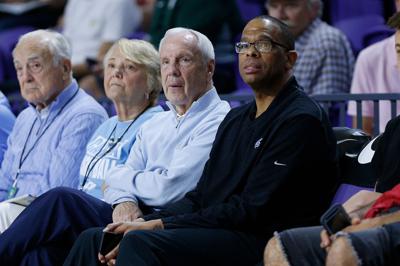 North Carolina head coach Roy Williams, left, and assistant coach Hubert Davis look on during the City Of Palms Classic at Suncoast Credit Union Arena on December 19, 2018, in Fort Myers, Florida.