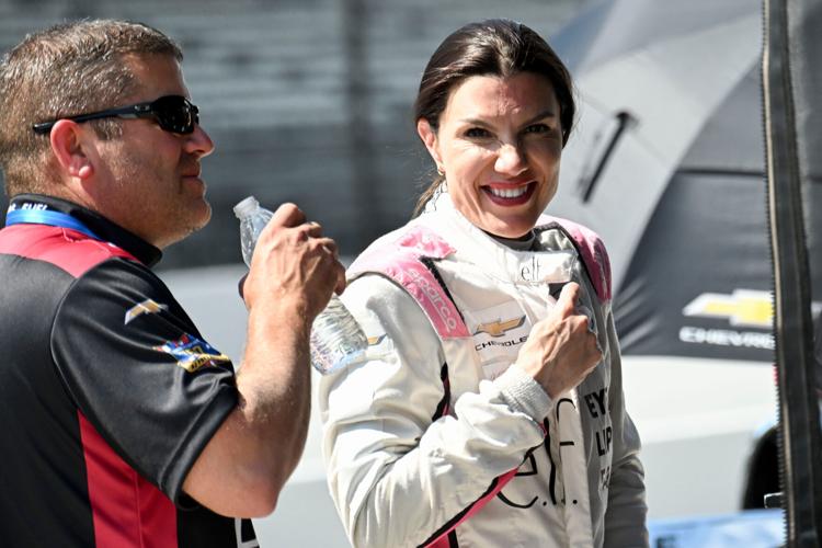 HMD Motorsports with AJ Foyt Racing driver Katherine Legge (11) talks in her pit box Tuesday, May 12, 2026, during practice for