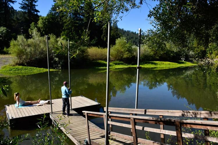 The Russian River runs past a dock at Dawn Ranch in Guerneville, Calif.