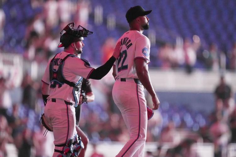 Marlins catcher Liam Hicks and Sandy Alcantara after a complete game in April.