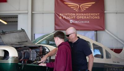 Coe-hangar-Tim-helping-WEB.jpg