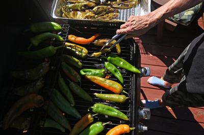 Kathy Trent cooks Hatch chiles as they are roasted, as she roasted 2 bushels of the freshly picked New Mexican chiles they shipped to Pittsburgh from the Hatch Green Chili Co. These chiles are then grilled and used in recipes, and some are frozen for la...