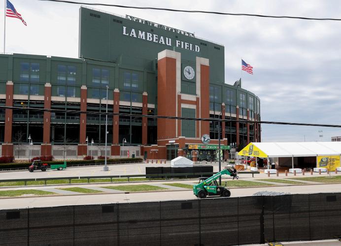 A forklift drives along Lombardi Avenue inside the NFL Draft perimeter on Sunday, April 27, 2025, at Lambeau Field in Green Bay,
