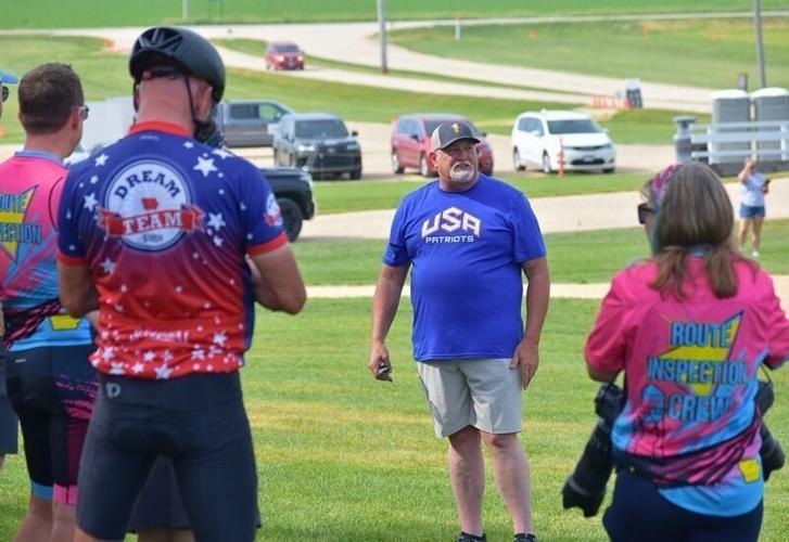 Keith Rahe, a founding member Field of Dreams Ghost Players, speaks to members of the RAGBRAI route inspection crew in Dyersville on June 6, 2026.