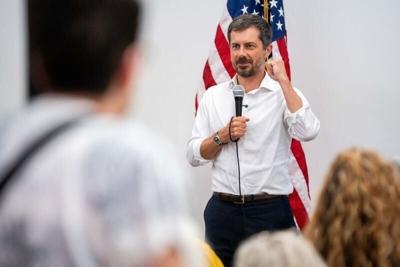 Former U.S. Secretary of Transportation Pete Buttigieg speaks to phone bank volunteers for Sarah Trone Garriott on July 13, 2026, in Des Moines.