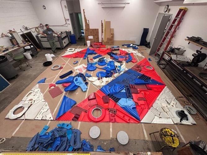 A quilt was stitched together using recycled plastics, a medium that interests Emily Newman, before floating in the pond at Wilson's Orchard in Cumming.