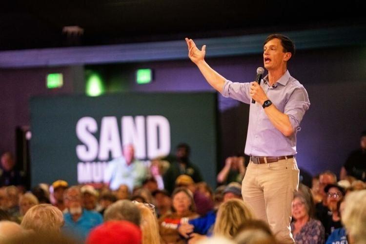Democratic gubernatorial candidate Rob Sand speaks to supporters while campaigning in West Des Moines on Sept. 30, 2026, at Val Air Ballroom.