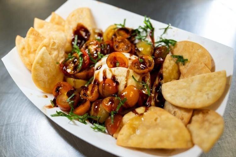 The Burrata Bomb salad with tomatoes, burrata cheese, balsamic glaze and fresh basil on July 16, 2026, at JR’s SouthPork Ranch at the Iowa State Fairgrounds.