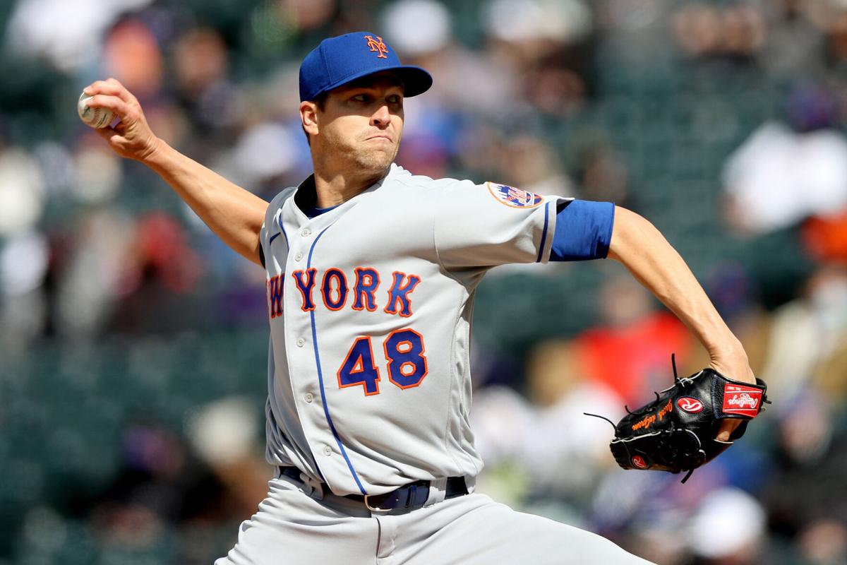 New York Mets pitcher Jacob deGrom throws against the Colorado Rockies during the first inning of the first game of a doubleheader at Coors Field in Denver on Saturday, April 17, 2021.