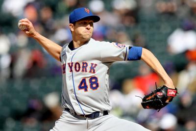 New York Mets pitcher Jacob deGrom throws against the Colorado Rockies during the first inning of the first game of a doubleheader at Coors Field in Denver on Saturday, April 17, 2021.