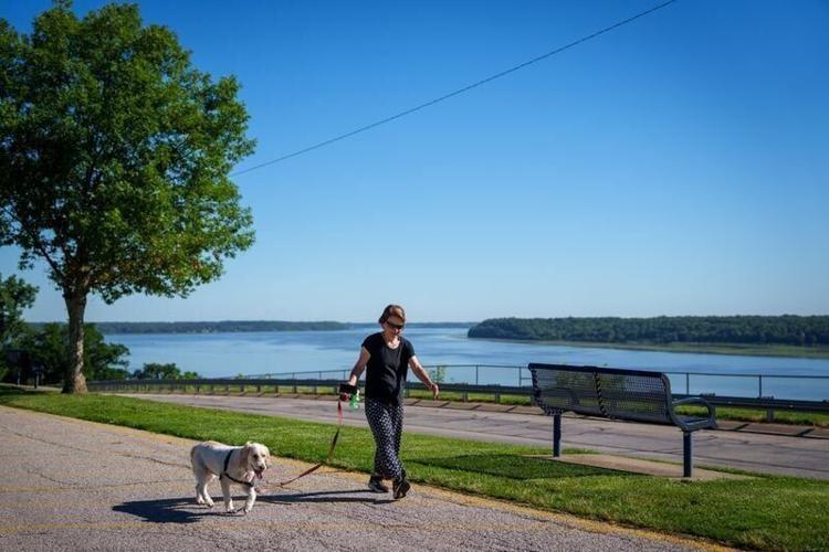 Ellen Norman walks her dog Beauregard at Rand Park, June 12, 2026, in Keokuk, Iowa.