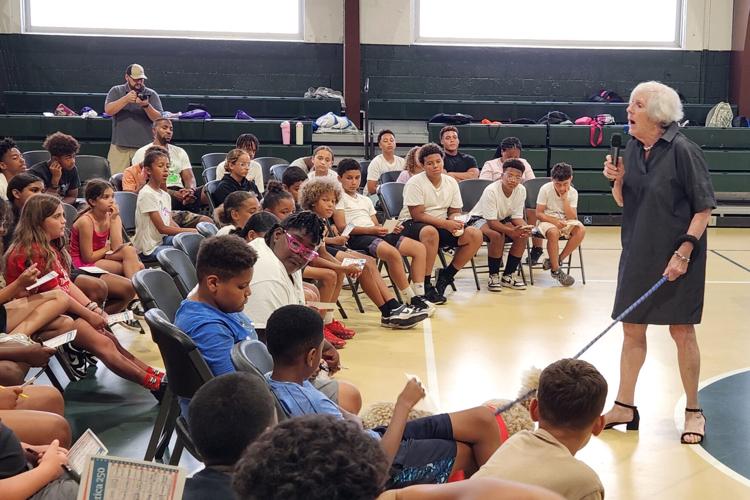 Former Ohio Supreme Court Chief Justice Maureen O'Connor speaks with students during the Justice in Motion bus tour.