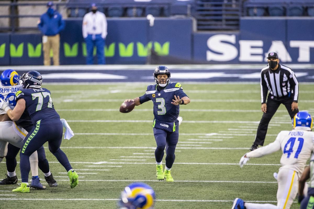 In this file photo, with protection and room to throw, Russell Wilson went 20-32, with 225 yards and a touchdown in a 20-9 win over the Rams.