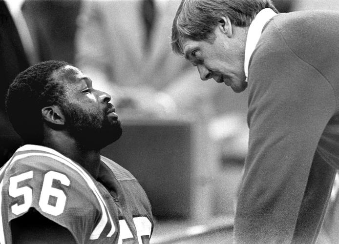 ORG XMIT: New England Patriots and the Chicago Bears in Superbowl XX at the Superdome, New Orleans, LA. January 26, 1986. Bears won 46-10. Patriots head coach Raymond Berry tries to give a comforting word to patriots linebacker #56 Andre Tippett near the e