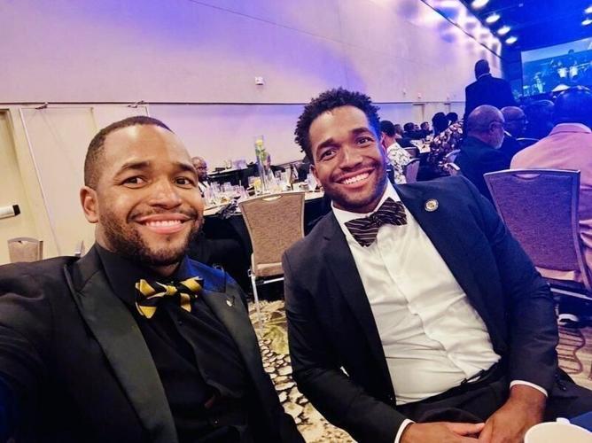 Quinlan (left) and Quentin Riser pose for a photo. The Riser brothers co-authored "Eden's Money Magic: Learning About Finances", a book that teaches children about financial literacy.