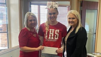Atomic Credit Union donates to Jackson cheerleaders