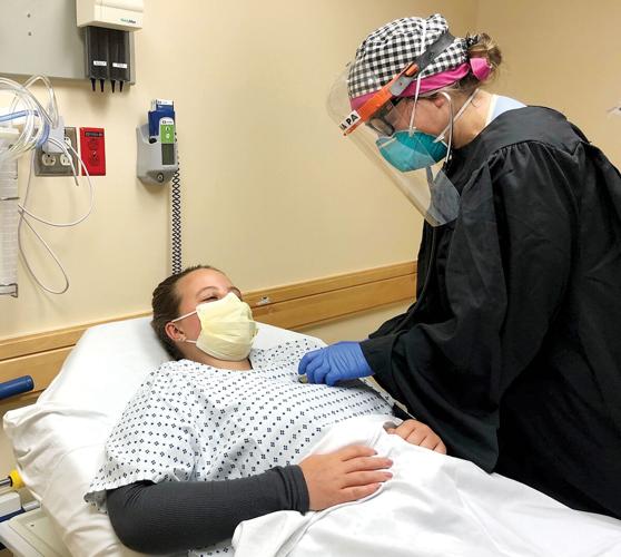 Medical professionals repurpose graduation gowns