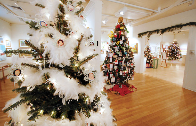 Festival of lights featuring several decorated trees to celebrate the holidays.