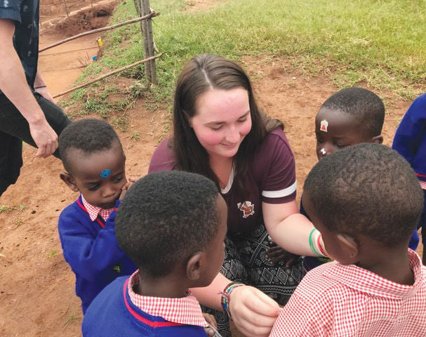 Rwanda kids with student