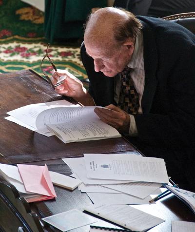 Senator William Doyle: Perusing legislation at his desk in the Senate Chamber.