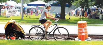 A cyclist bikes by the Parade Ground